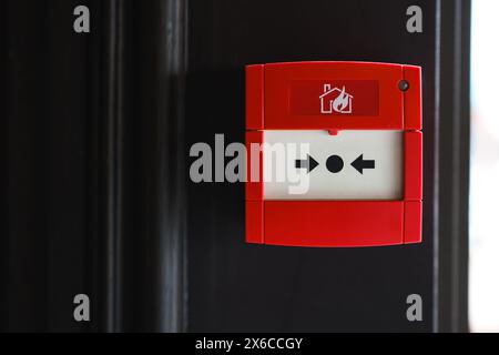 Full front view of outdoor wall mounted fire alarm button Stock Photo