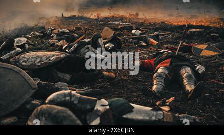 After Epic Battle Bodies of Dead, Massacred Medieval Knights Lying on Battlefield. Warrior Soldiers Fallen in Conflict, War, Conquest, Warfare, Colonization. Cinematic Dramatic Historical Reenactment Stock Photo