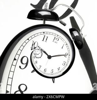Infinity and other time related concepts. Alarm clock face twisted in spiral, fractal pattern Stock Photo