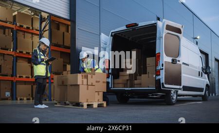 Outside of Logistics Distributions Warehouse With Inventory Manager Using Tablet Computer, talking to Worker Loading Delivery Truck with Cardboard Boxes. Online Orders, Purchases, E-Commerce Goods Stock Photo
