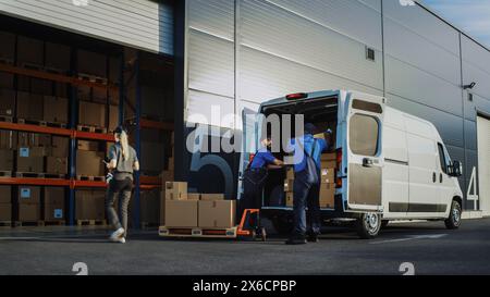 Outside of Logistics Distributions Warehouse With Manager Using Tablet Computer, Workers Start Loading Delivery Truck with Cardboard Boxes. Online Orders, Purchases, E-Commerce Goods. Stock Photo