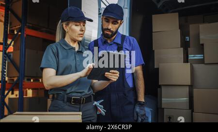Outside of Logistics Distributions Warehouse With Inventory Manager Using Tablet Computer, talking to Worker Loading Delivery Truck with Cardboard Boxes. Online Orders, Purchases, E-Commerce Goods Stock Photo