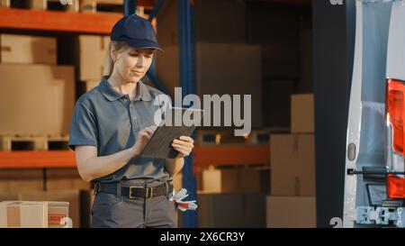 Portrait of Beautiful White Woman Worker Using Tablet Computer To Check Inventory. Happy Professional Working in Logistics Retail Center, Delivering e-Commerce Online Orders, Food, Frontline Heroes Stock Photo