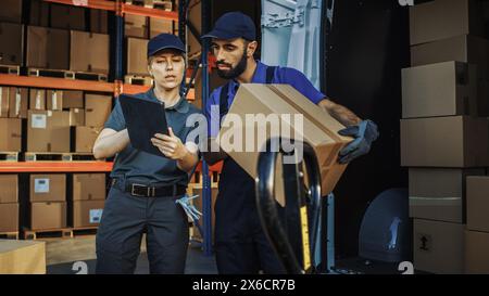Outside of Logistics Distributions Warehouse With Inventory Manager Using Tablet Computer, talking to Worker Loading Delivery Truck with Cardboard Boxes. Online Orders, Purchases, E-Commerce Goods Stock Photo