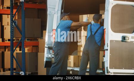 Outside of Logistics Distributions Warehouse: Workers Talk, Joke use Hand Pallet Truck Start Loading Delivery Truck with Cardboard Boxes, Online Orders, Purchases, E-Commerce Goods. Stock Photo