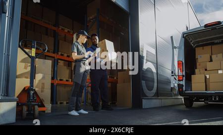 Outside of Logistics Distributions Warehouse With Manager Using Tablet Computer, Diverse Workers Loading Delivery Truck with Cardboard Boxes. Online Orders, Purchases, E-Commerce Goods. Stock Photo