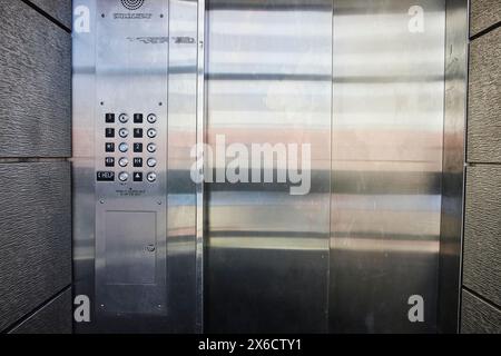 Modern Elevator Door and Panel, Eye-Level View Stock Photo