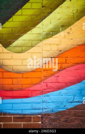 Colorful Geometric Street Art on Brick, Urban Eye-Level Perspective Stock Photo