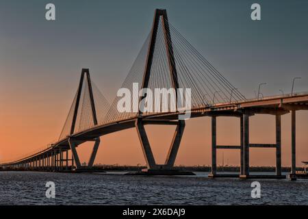 Beautiful sunset colors seen from Memorial Waterfront park and the Arthur Ravenel, Jr. Bridge in Mt. Pleasant, South Carolina, USA Stock Photo