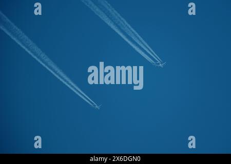 two parallel airplane tracks in the blue sky, contrails Stock Photo - Alamy