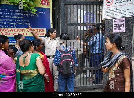 NEW DELHI, INDIA - MAY 14: Patient seen gathered outside the Deep Chand Bandhu Hospital as the Bomb Squad from Delhi Police carries out search operation reportedly after a bomb threat was received in the early hours of morning at Ashok Vihar on May 14, 2024 in New Delhi, India. Four Delhi hospitals, including Deepchand Bandhu Hospital, Dada Dev Hospital, Hedgewar Hospital and Guru Teg Bahadur (GTB) Hospital, received bomb threat emails on Tuesday, two days after similar messages were sent to 20 hospitals, the airport and the office of the Northern Railways' CPRO in the capital, officials said. Stock Photo