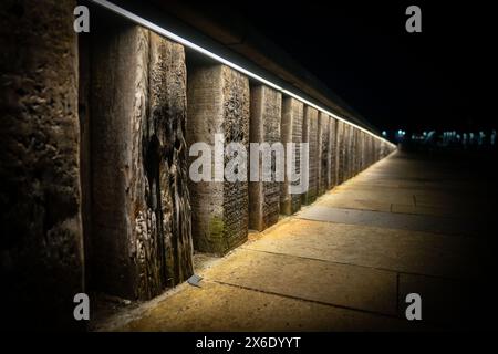 The pavement, wall and lighting on the main road through Ullapool, leading to the ferry port. Stock Photo