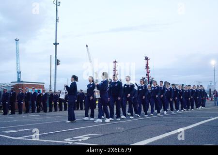 France's Freedom Flame is carried in a procession at Portsmouth International Port. The Flamme de la Liberte, which normally resides under Paris' Arc de Triomphe, was brought by ferry to Portsmouth before departing for Arlington, Virginia, USA. The move is to pay thanks to the UK and USA as part of D-Day 80th anniversary commemorations. Picture date: Tuesday May 14, 2024. Stock Photo