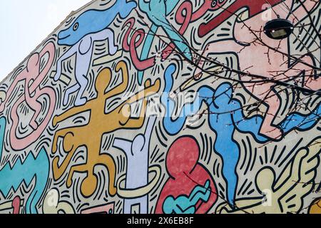 Pisa, Italy - 30 December 2023: Tuttomondo (English: All World), a mural created by American artist Keith Haring in 1989. Located on the rear wall of Stock Photo