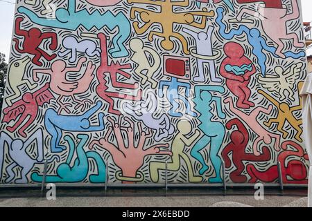 Pisa, Italy - 30 December 2023: Tuttomondo (English: All World), a mural created by American artist Keith Haring in 1989. Located on the rear wall of Stock Photo