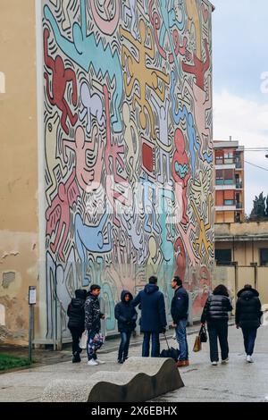 Pisa, Italy - 30 December 2023: Tuttomondo (English: All World), a mural created by American artist Keith Haring in 1989. Located on the rear wall of Stock Photo