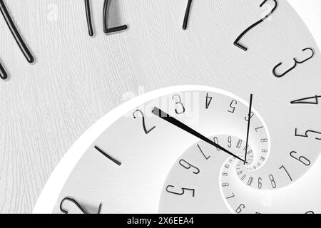 Infinity and other time related concepts. White clock face twisted in spiral, fractal pattern Stock Photo