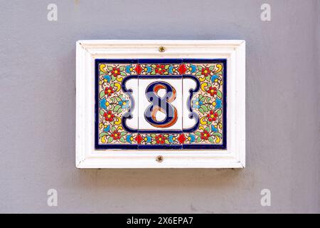 Ornate floral ceramic number 8 panel Stock Photo