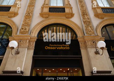 Milan, Italy - 24.04.2024: Fondazione Prada Osservatorio showcase located at shopping gallery in the center of Milan, Galleria Vittorio Emanuele Stock Photo