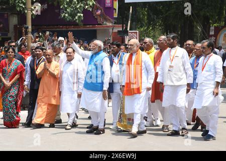 Varanasi, India. 14th May, 2024. Indian Prime Minister Narendra Modi (C) gestures to supporters next to India's Home Minister Amit Shah (R) and Uttar Pradesh Chief Minister Yogi Adityanath (L) after filing his nomination papers for the general elections in Varanasi. Credit: SOPA Images Limited/Alamy Live News Stock Photo