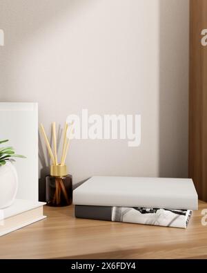 Products pedestal on books on a wooden table feature a reed diffuser and a potted plant against the white wall in a room. a close-up shot, home decora Stock Photo