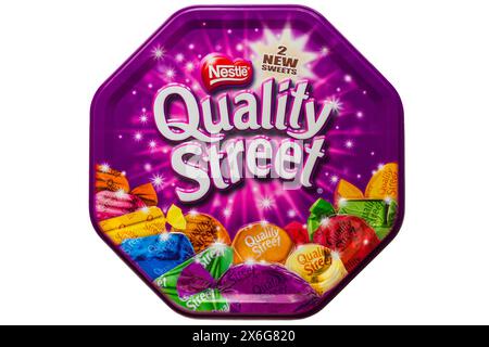 Tin of Nestle Quality Street chocolates sweets metal tin isolated on white background Stock Photo