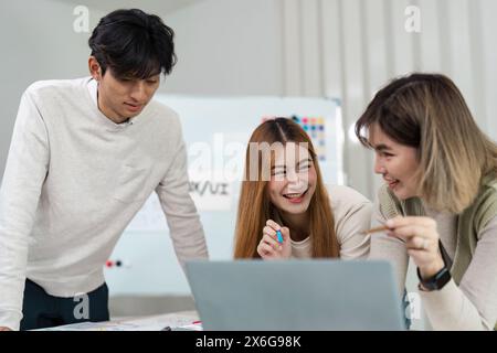 team of UI UX web designer are working together to develop mobile responsive websites with UI UX front end designer previews Stock Photo