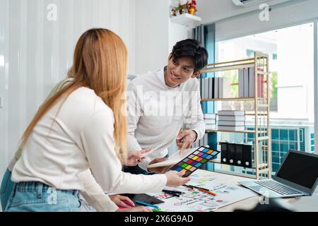 UI designers present to team about color design of logo during application design brainstorming. Creative digital development agency. UX UI concept Stock Photo