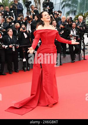 CANNES, May 15, 2024 (Xinhua) -- French actress Juliette Binoche arrives at the red carpet of the opening ceremony during the 77th edition of the Cannes Film Festival in Cannes, southern France, on May 14, 2024. The 77th edition of the Cannes Film Festival opened Tuesday on the French Riviera, with a selection of 22 films vying for the coveted Palme d'Or. This year's film competition includes entrees such as 'Kinds of Kindness' by Greek director Yorgos Lanthimos and epic science fiction drama 'Megapolis' by double Palme d'Or winner, Francis Ford Coppola. Asian filmmaker Stock Photo