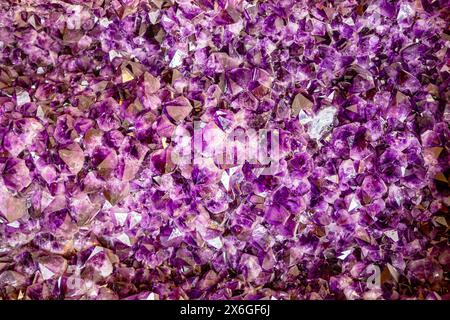 Amethyst purple crystal. Mineral crystals in the natural environment. Texture of precious and semiprecious gemstone. Macro photo of lilac amethyst cry Stock Photo