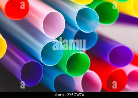 Colorful drinking straws on a black background. Close up Stock Photo