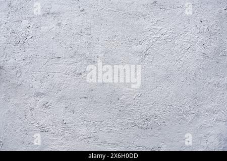 White or gray rough grainy concrete wall texture background. Stock Photo