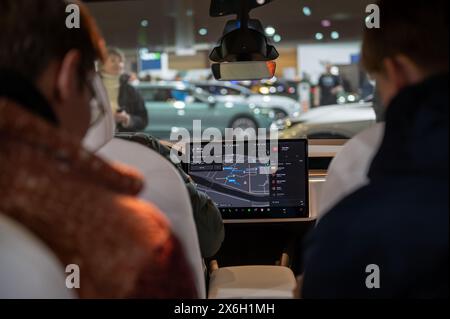 Riga, Latvia, April 19, 2024: A view of the luxury interior of the cabin and the digital information panel on the teslacar model x Stock Photo