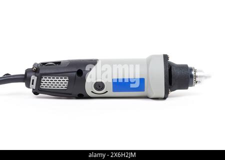 Close-up side view of a compact mini drill isolated on white background. Stock Photo