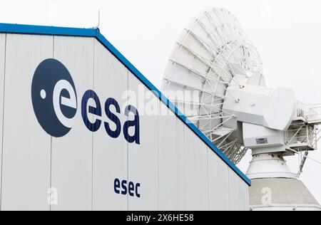 A logo and satellite dish pictured at a royal visit to the European Space Security and Education Centre (ESEC), in Redu, Wednesday 15 May 2024. The ESEC is one of seven ESA European Space Agency ground stations. The center has about forty steerable antennas and its main task and ambition is to become the reference within ESA for the operations of all its small satellite missions and CubeSats. In addition, ESEC also studies meteorological conditions in space, is increasingly developing cyber security activities and hosts a space training center BELGA PHOTO BENOIT DOPPAGNE Stock Photo