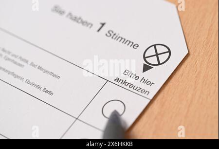 Stuttgart, Germany. 15th May, 2024. A ballot paper for the European Parliament election lies on a table. Credit: Bernd Weißbrod/dpa/Alamy Live News Stock Photo