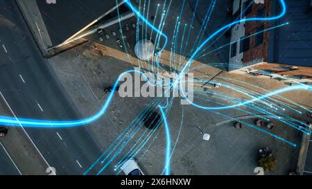 VFX and E-Commerce Visualization of Information Lines Flying from Mobile Phone into Global Digital Network. Top Down Aerial Drone Shot in Business Downtown District. Stock Photo