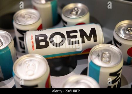 Milano, Italy. 15th May, 2024. Cans of BOEM soft drink, a project of Italian rappers Fedez and Lazza, are being seen as sponsors at the opening of the exhibition Obey: The Art Of Shepard Fairey at Fabbrica del Vapore in Milano, Italy, on May 15, 2024. The exhibition is being dedicated to Shepard Fairey, one of the most influential and internationally acclaimed artists. With his art, he is contributing significantly to the evolution of Street Art and its languages. (Photo by Mairo Cinquetti/NurPhoto) Credit: NurPhoto SRL/Alamy Live News Stock Photo