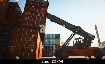 Modern Container Handler Carrying a Large Red Steel Shipping Cargo ...