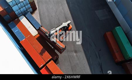 modern container handler carrying a large red steel... Modern Container Handler Carrying a Large Red Steel Shipping Cargo ...