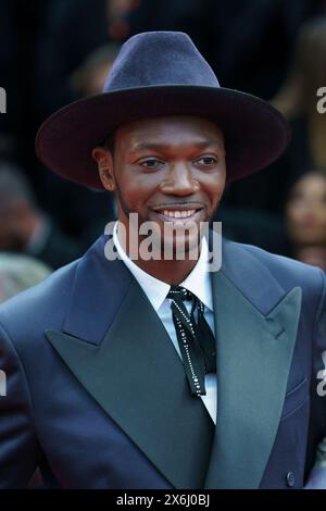 Cannes, France. 14th May, 2024. CANNES - MAY 14:  Baloji attending at the Opening Ceremony and The Second Act gala premiere, Palais des Festival, part of the 77th edition of The Cannes Film Festival Stock Photo
