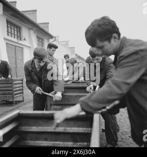 Socialist Republic of Romania in the 1970s. Students being trained to work various jobn in a state-owned factory. Stock Photo