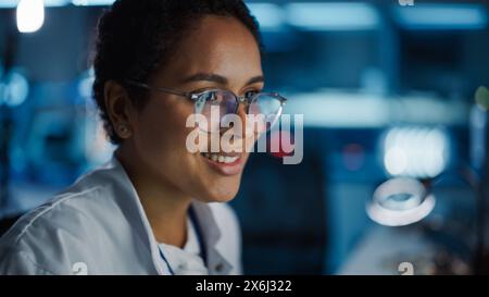 Young beautiful hispanic woman scientist smiling confident mixing ...
