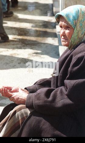 Romania, approx. 2000. Elderly woman begging for money on the street. Stock Photo