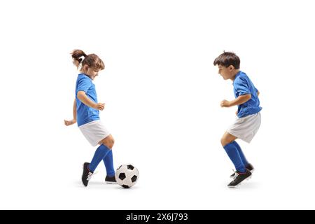 Boy and girl playing football isolated on white background Stock Photo