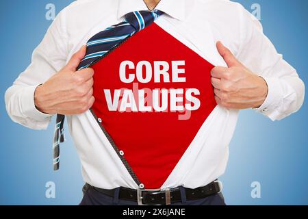 Businessman showing slogan Core Values under his shirt as business concept Stock Photo