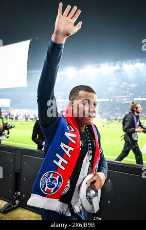 Kylian MBAPPE of PSG celebrates first place in the 2023-24 French Ligue 1 championship with the trophy during the French championship Ligue 1 football match between Paris Saint-Germain and Toulouse FC on May 12, 2024 at Parc des Princes stadium in Paris, France - Photo Matthieu Mirville / DPPI Stock Photo