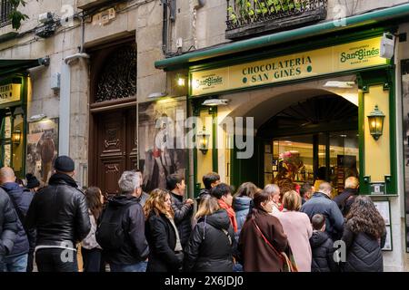 Madrid, Spain. February 11, 2024 - People waiting in line outside Chocolateria San Gines Stock Photo