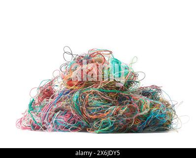 pile of tangled colorful sewing threads isolated white background Stock Photo