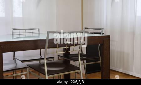 Table in office setting with four chairs Part of a series. Stock Photo